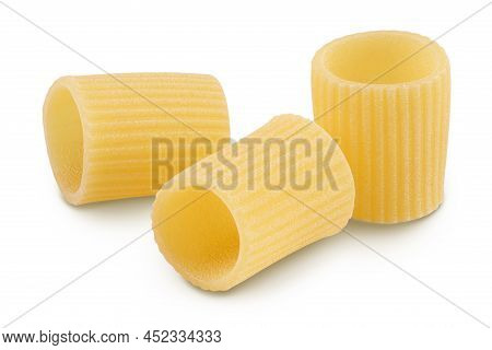 Raw Italian Pasta In Wooden Bowl Isolated On White Background With Clipping Path . Mezze Maniche Rig