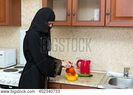 Muslim Woman Kitchen Preparing Fresh Vegetable Salad.