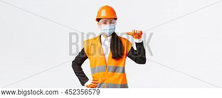 Covid-19 Safety Protocol At Enterpise, Construction And Preventing Virus Concept. Confident Asian Fe