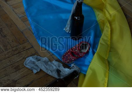 Childrens Shoes And The Flag Of Ukraine, The Warthe War In Ukraine.
