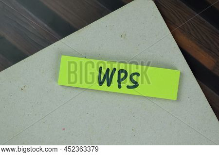 Wps Write On Sticky Notes Isolated On Wooden Table.