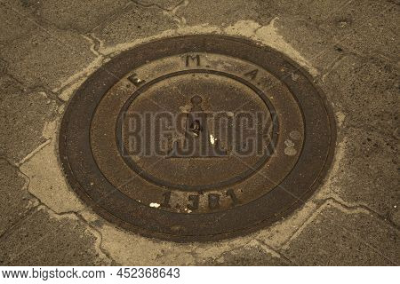 Quito, Ecuador, 18 June 2019. The Sewer Hatch With Middle Of The World  Symbol (mitad Del Mundo), Qu