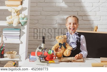 Cute Lovely School Childr Girl Wearing School Uniform Study Hold Toy Teddy Bear At Classroom Having 