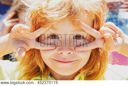 Kids Funny Face. Close Up Portrait Of Fyn Child Making Funny Expressions.