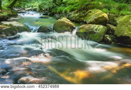 Golitha Waterfalls,summertime Rocks And Flowing Waters,liskeard,cornwall,england,uk
