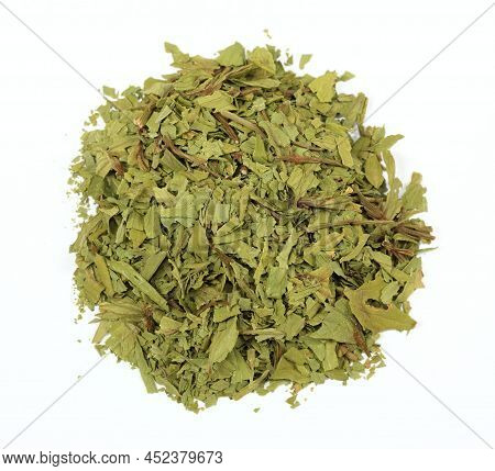 Dried Lovage, Famous Culinary Herb, Lat. Levisticum Officinale. Heap Of Dried Lovage On The White Ba