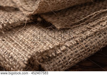 Rural Texture Of Sackcloth. Background Of Very Coarse, Rough Fabric Woven Made Of Flax, Jute Or Hemp