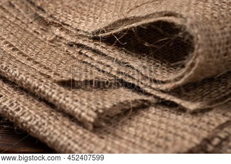 Rural Texture Of Sackcloth. Background Of Very Coarse, Rough Fabric Woven Made Of Flax, Jute Or Hemp