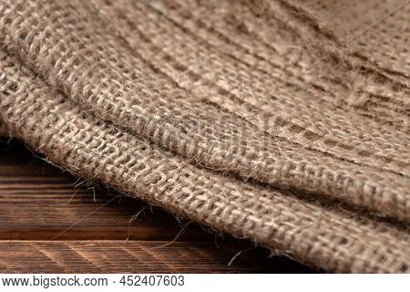 Rural Texture Of Sackcloth. Background Of Very Coarse, Rough Fabric Woven Made Of Flax, Jute Or Hemp