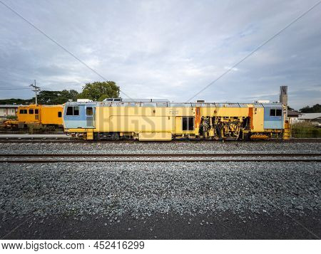 The Ballast Tamping Machine Is Working To Maintain The Sleeper And Ballast Stone In The New Railway 