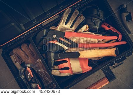 Modern Contractor Toolbox With Tools, Gloves And Eye Protection Glasses Top View.