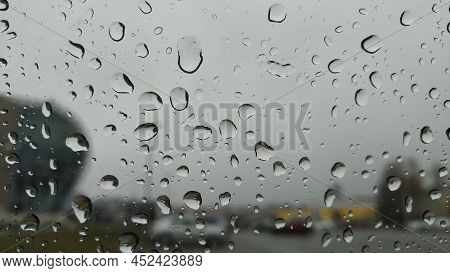Rain Outside The Window. Early Spring Rain. Gloomy, Neobhodimo Covered With Clouds. Large Drops Of R