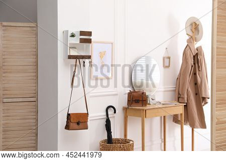 Modern Hallway Interior With Stylish Dressing Table And Key Holder