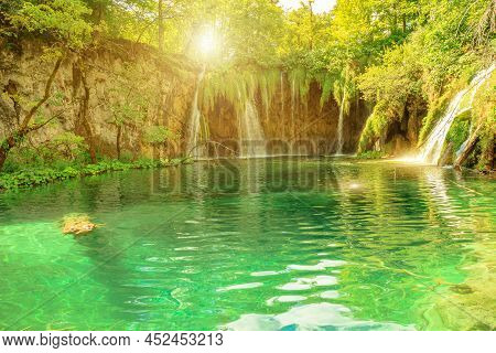 Sunshine On Milino Jezero Lake And Galovacki Buk Waterfall Of Plitvice National Park In Croatia. Nat