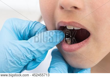 Dentist Is Check And Set Dimension Of Brackets. Talking To Girl About Braces In Her Mouth