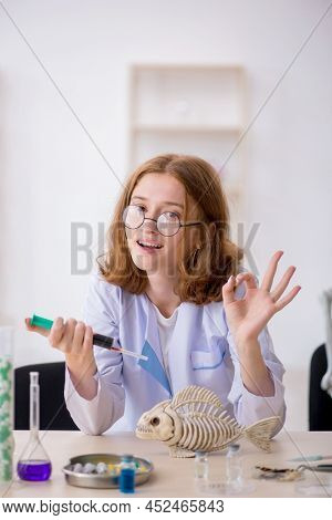 Young female zoologist working at the lab