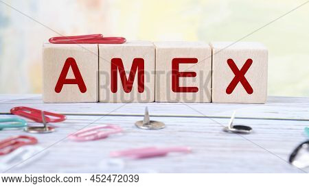 Wooden Cubes And Amex, Coins, The Concept Of Taxation, Increase Taxes And Fees.