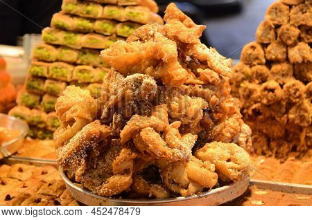 Baklava  Baked With Sugar And Honey Syrup, Sweet And Stuffed With Nuts. Baklava On The Oriental Mark