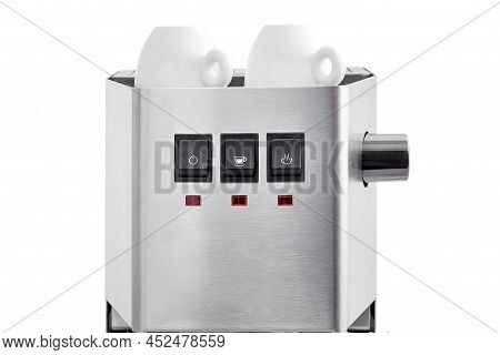 2 Ceramic White Espresso Cups Stand On Warming Top Of A Coffee Machine, A Steel Coffee Maker And Bla