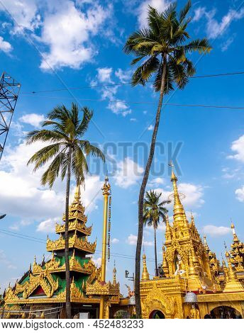Group Of Golden Pagoda And Square Hall Mondop And Golden Tiered Umbrella Under The Blue Sky