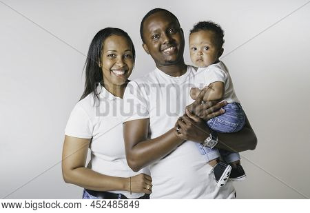 Young African American Family In The Studio With Baby Toddler Son