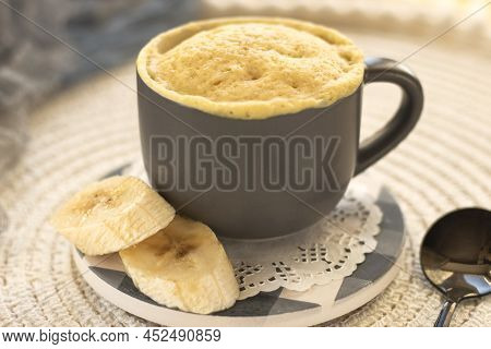 Homemade Portioned Banana Bread Mugcake In Small Mugs.