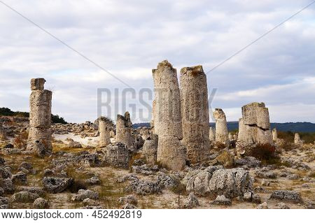 Ancient Stone Pillars Pobite Stones In Bulgaria Against A Cloudy Sky.