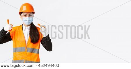 Covid-19 Safety Protocol At Enterpise, Construction And Preventing Virus Concept. Asian Female Chief