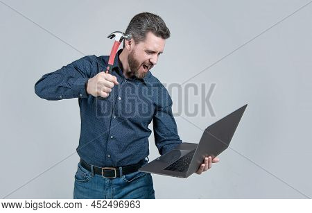 Spate Of Cyberattack. Hacker Assaulting Computer With Hammer. Targeted Cyberattack