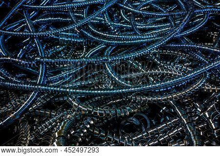Long Curly Blue Steel Swarf Closeup Full-frame Industrial Background.