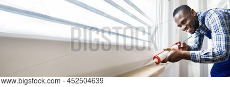 Caulk Sealant Application. Silicone Window Seal And Waterproofing