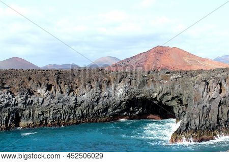 The Sea,cliffs And Volcanoes This Is A Typical Image Of The Island Of Lanzarote.