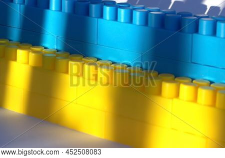 Background Ukraine Flag Brick Wall, Childish Cubes. Banner. Bright Toys With Stripes Concept Up Clos