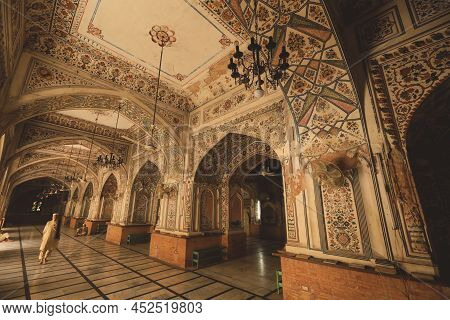 Peshawar, Pakistan - July 21, 2021: Muslim Sleeping And Praying Men Inside Mahabat Khan Mosque In Pe