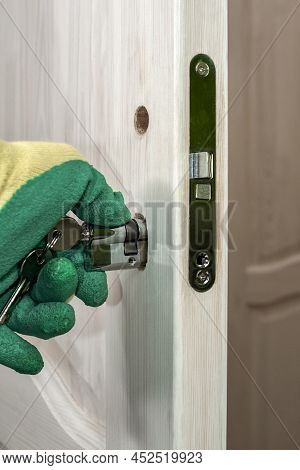 Door Lock Repair And Cylinder Replacement. Installation And Insertion Of A Cylinder With Keys For A 