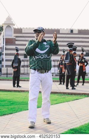 Wagah Border, Pakistan - July 22, 2021: Brave Pakistan Soldiers In Bright Military Uniform Marching 