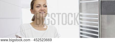 Portrait Of Young Woman Looking In Mirror At Herself In Bathroom, White Smile, Natural Beauty, No Ma