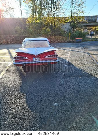 Velbert, Nrw, Germany - November 10, 2020:
Rear View Of A Red Colored 1960 Chevrolet Impala In A Pub