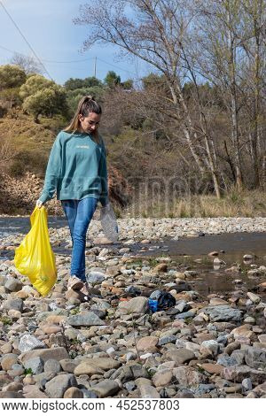 Woman Enviromental Activist Walking To Cleanup The Desaster Created By Humans