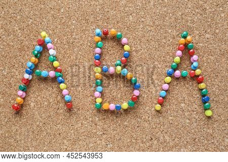 Applied Behavior Analysis Concept. Corkboard With Abbreviation Aba Made Of Colorful Pins