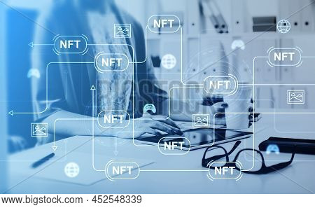 Businesswoman Holding Coffee Cup Typing On Tablet Device. Digital Interface With Non-fungible Token 