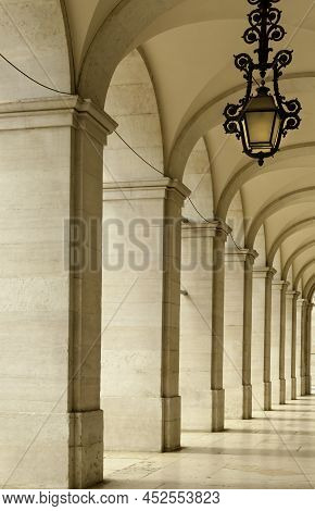 One Of The Arched Walkways In Lison, Portugal, Alongside The The Triumphal Arch Better Known As The 