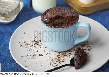 Mugcake Is Microwaved. Homemade Cupcake In A Mug Is On A Plate.