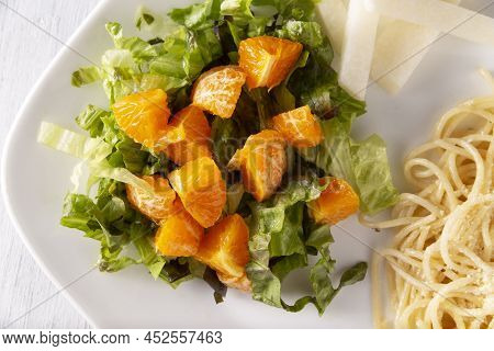 Fresh Mixed Lettuce And Tangerine Salad, Accompanied By Jicama 