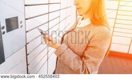 Postal Terminal. Post Delivery Automat Service And Hands With Parcel Courier Box. Mail Delivery And 