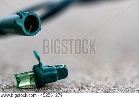 Focus On Replacement Bulb For A String Of Christmas Lights To Repair A Dud.