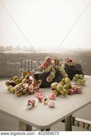 Group Of Manila Tamarind Fruit Or Pithecellobium Dulce Is Another Type Of Thai Herb On Black Rock On