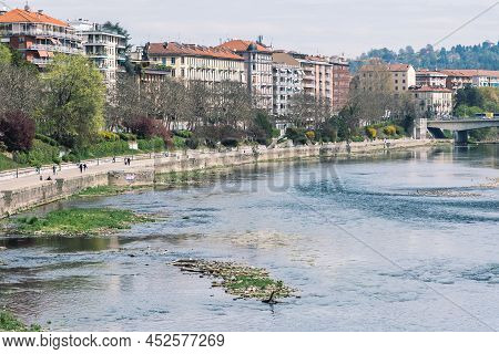 Torino, Italy - April 8 2022: Aerial View Of Po River In Torino, Italy With Buildings And Murazzi In