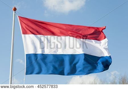04-02-2022 Dutch National Flag Waving In The Wind On A Sunny Day With A Blue Sky