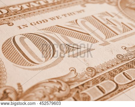 American Paper Money. 1 Us Dollar Bill. Word One Close-up. Light Brown Tinted Background Or Wallpape